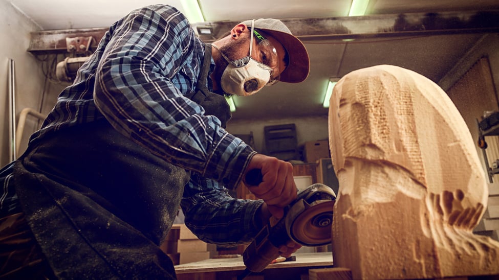 Man Carving Wood